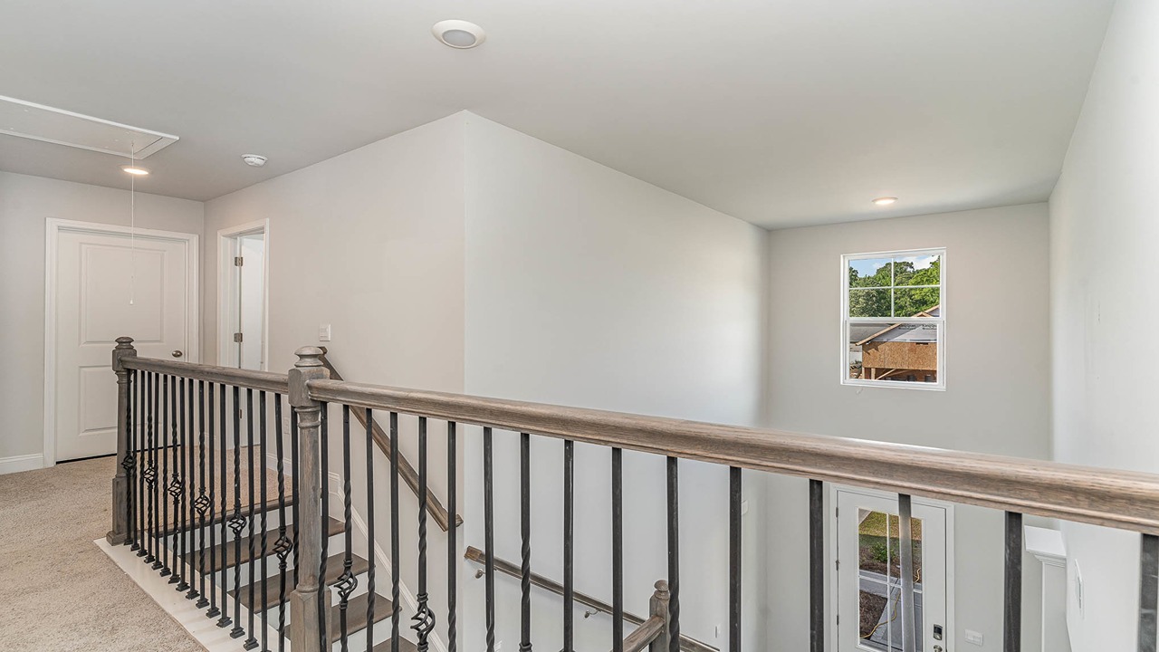 Upstairs stair landing overlooking the foyer