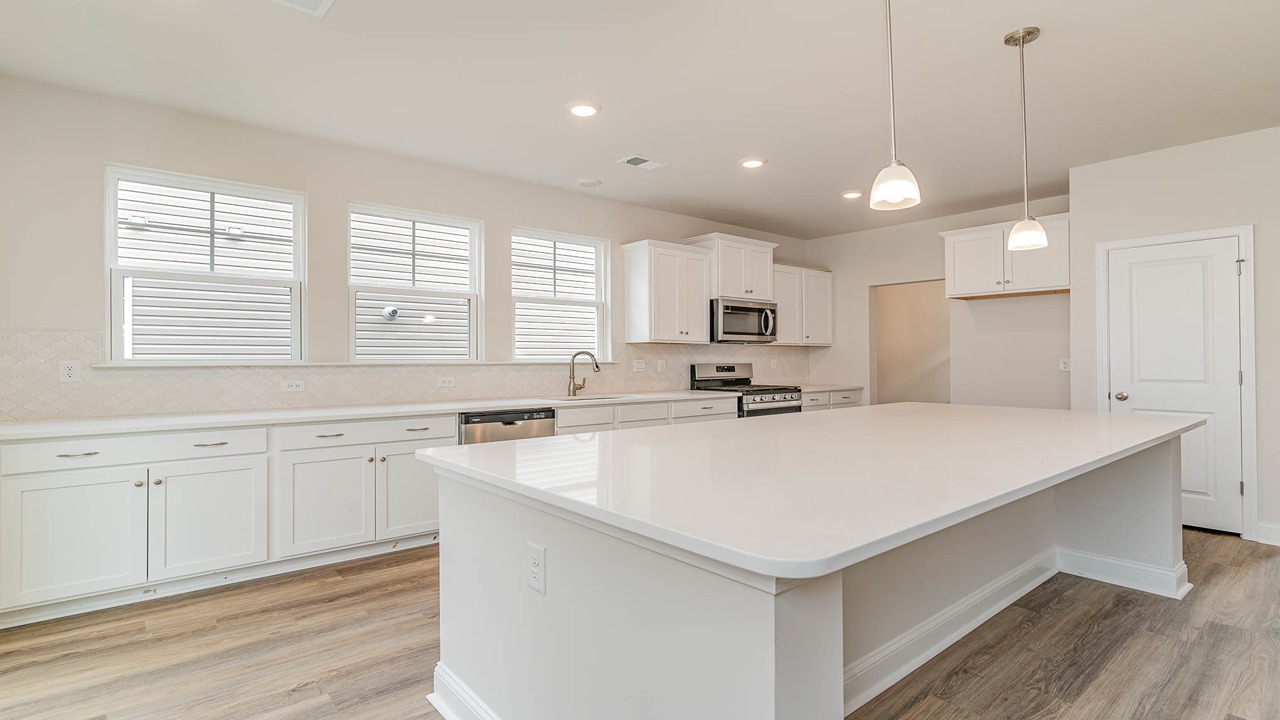 There is ample kitchen cabinet space.