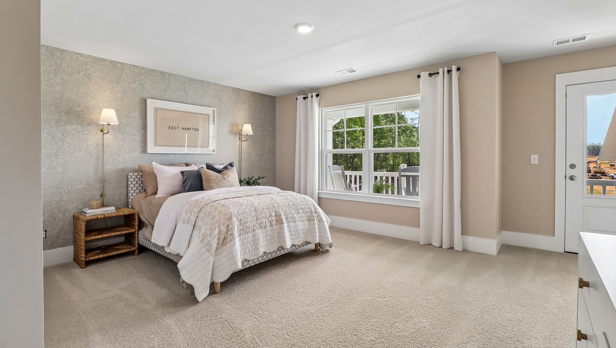 Large bedroom 2 upstairs with lots of room and front-facing windows for natural light