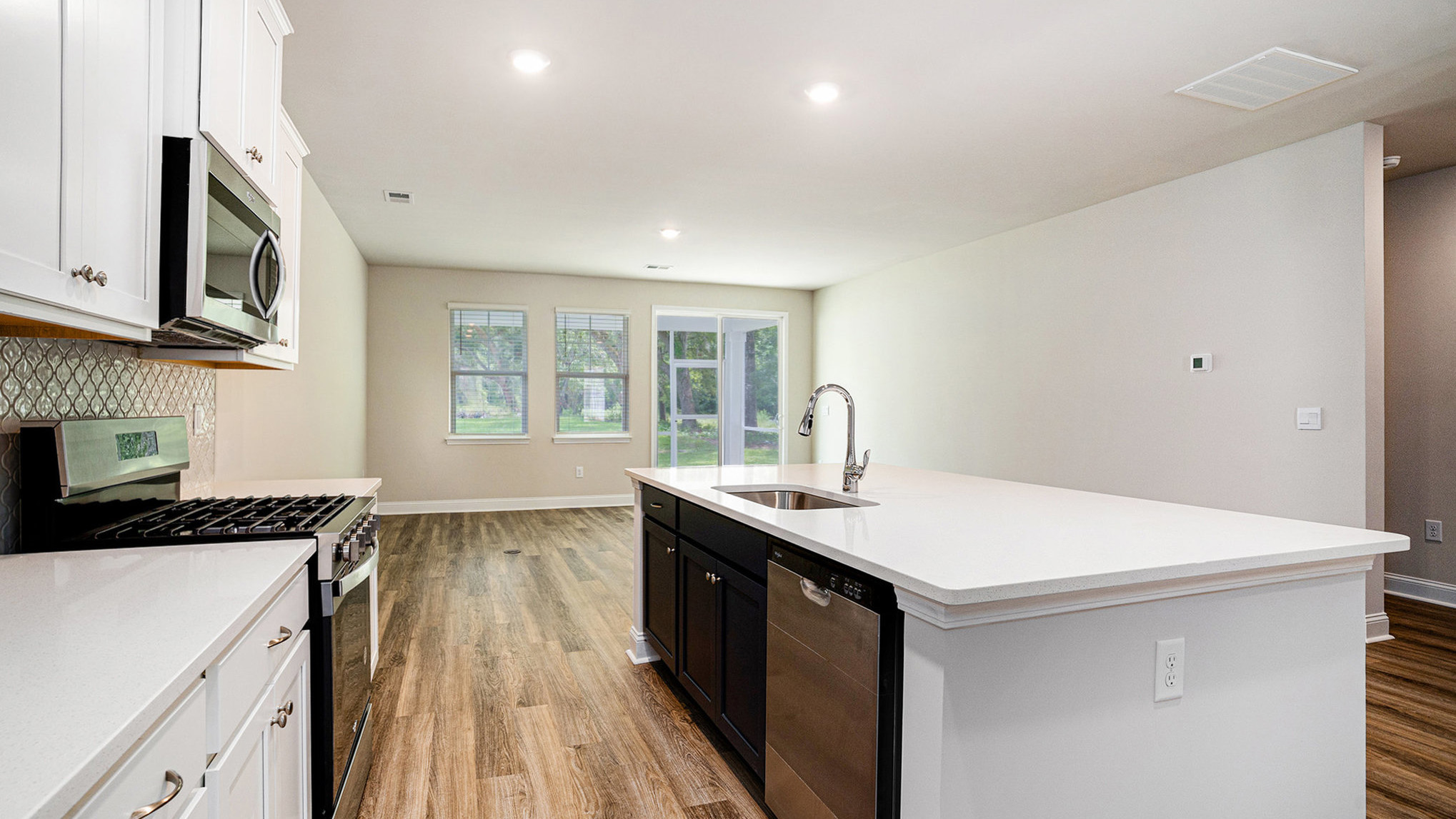 Floating kitchen island overlooks living area