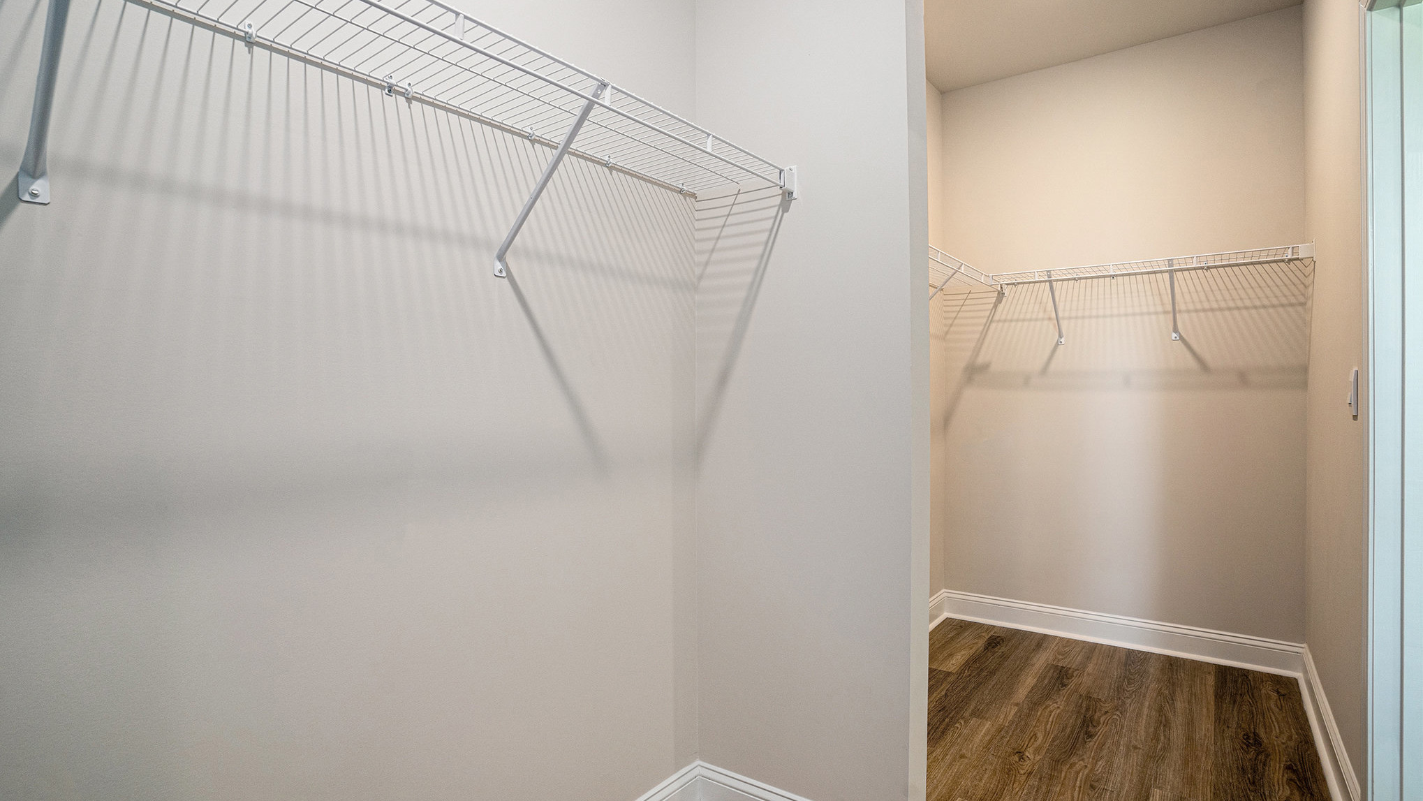 Two walk-in primary closets