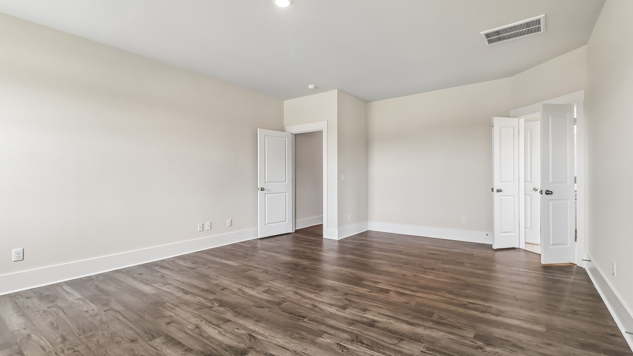 Private primary suite in new construction home on the first floor