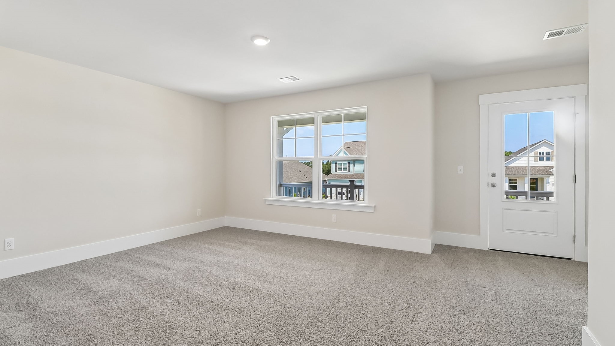 Bedroom 2 with access to second-level porch from a second-story front door