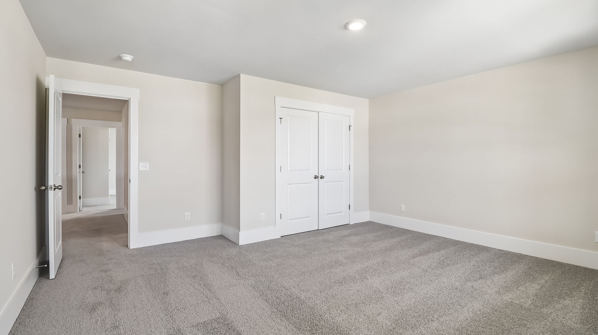 French closet doors in bedroom 2 and carpet floors