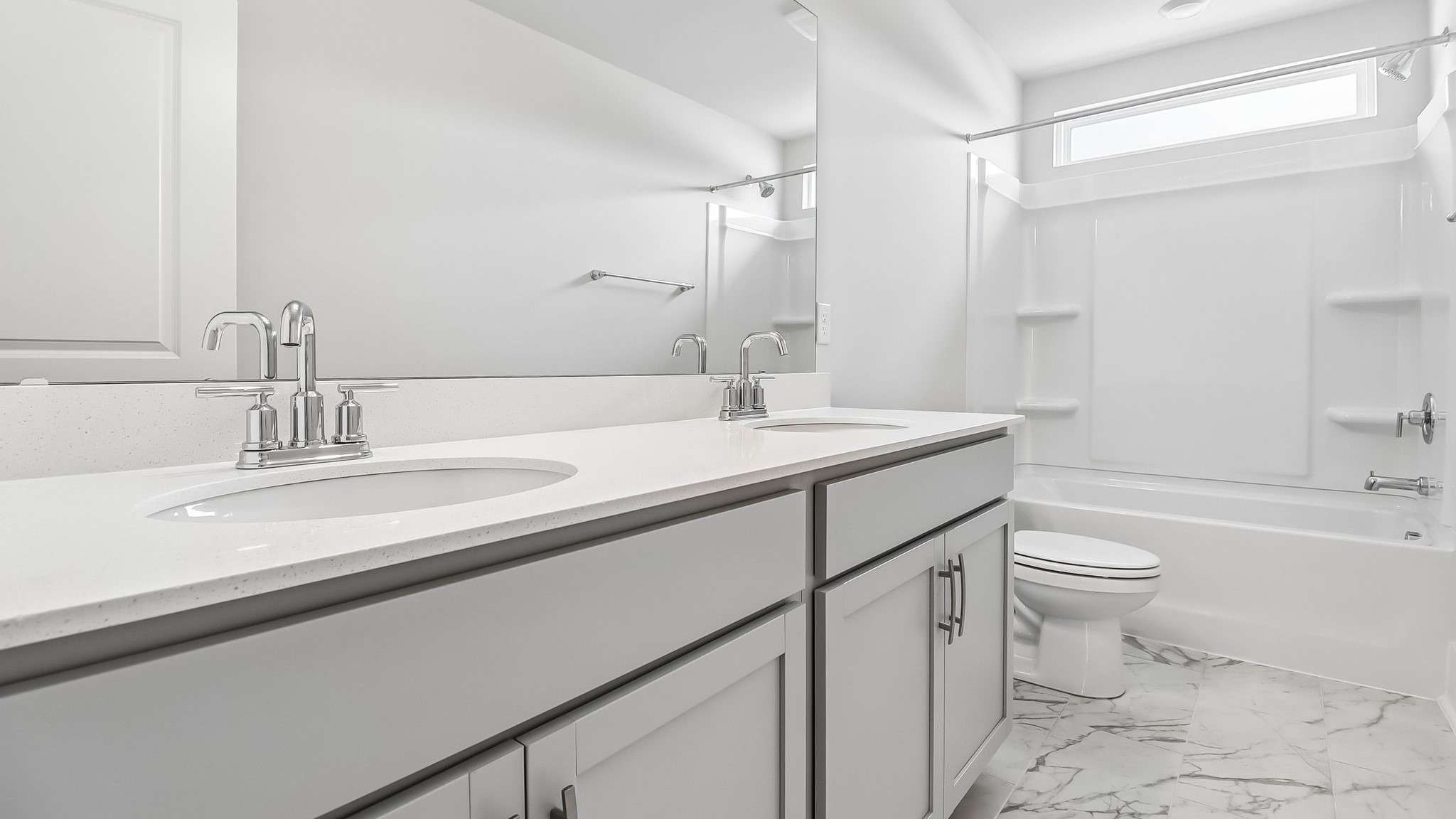 Bathroom 3 upstairs in new construction home with a double vanity and shower tub combo