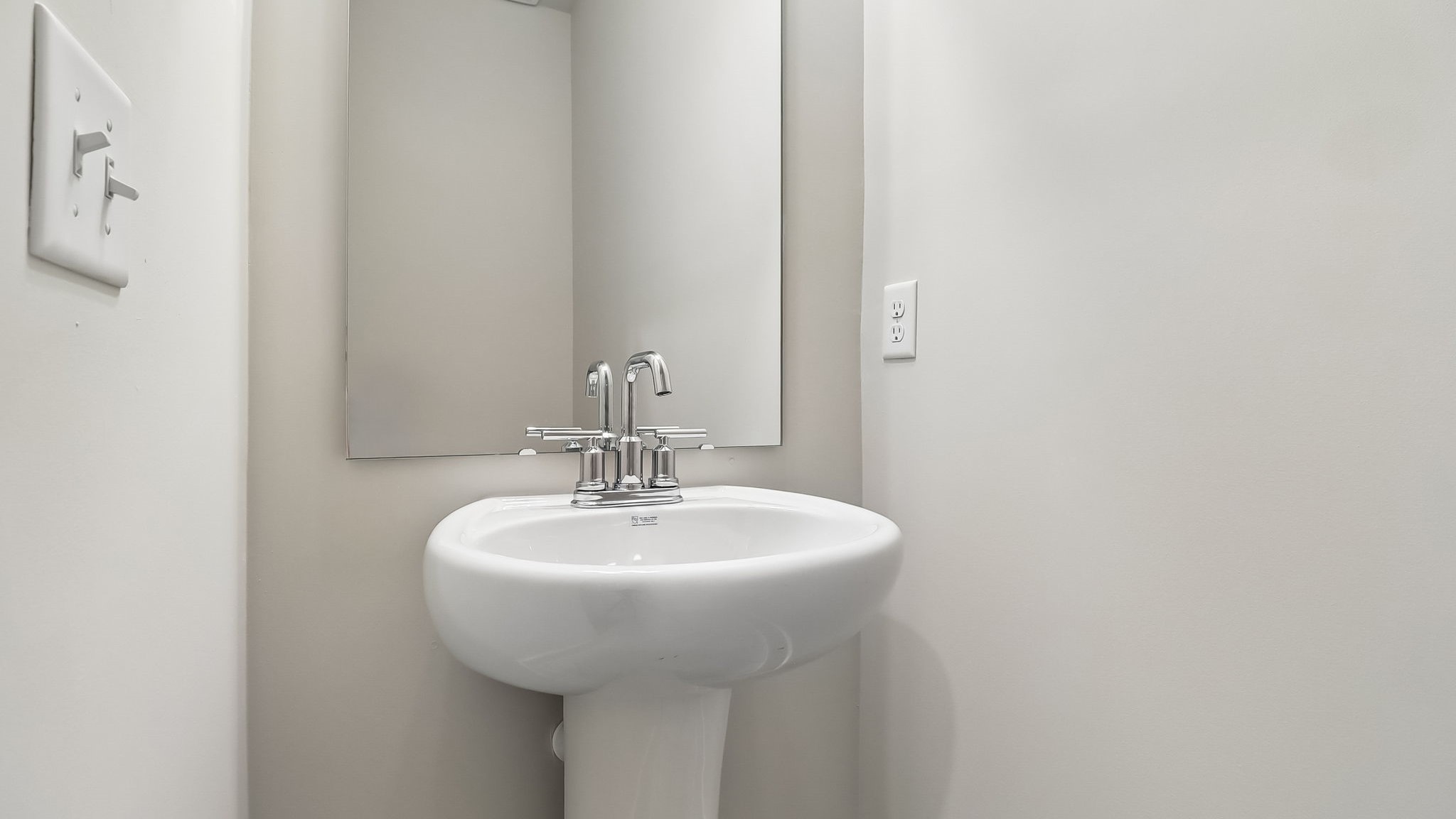 Powder room on the first floor of new construction home in Shell Pointe