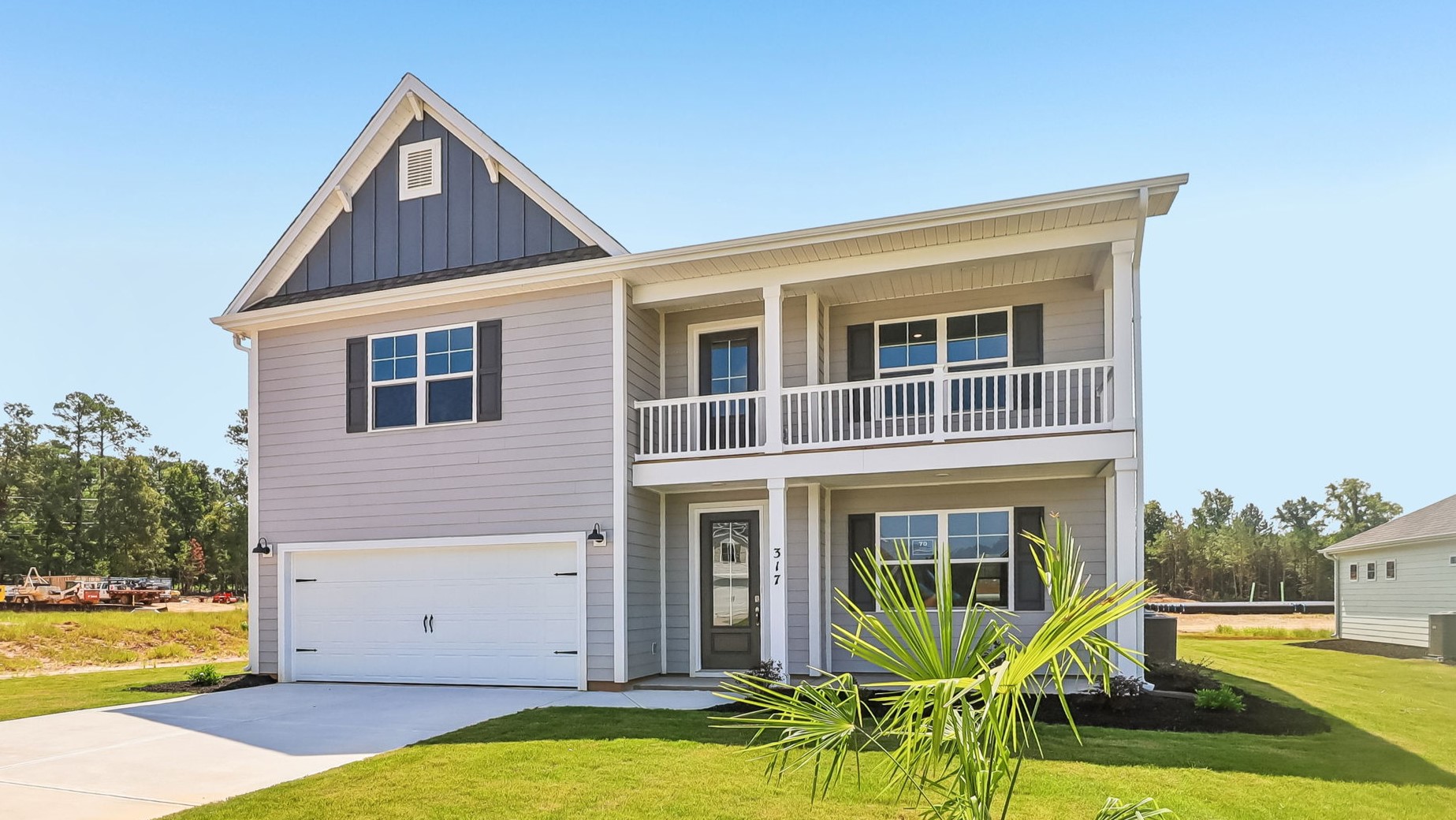 Two-story new construction home with double stacked front porches on Lake Murray