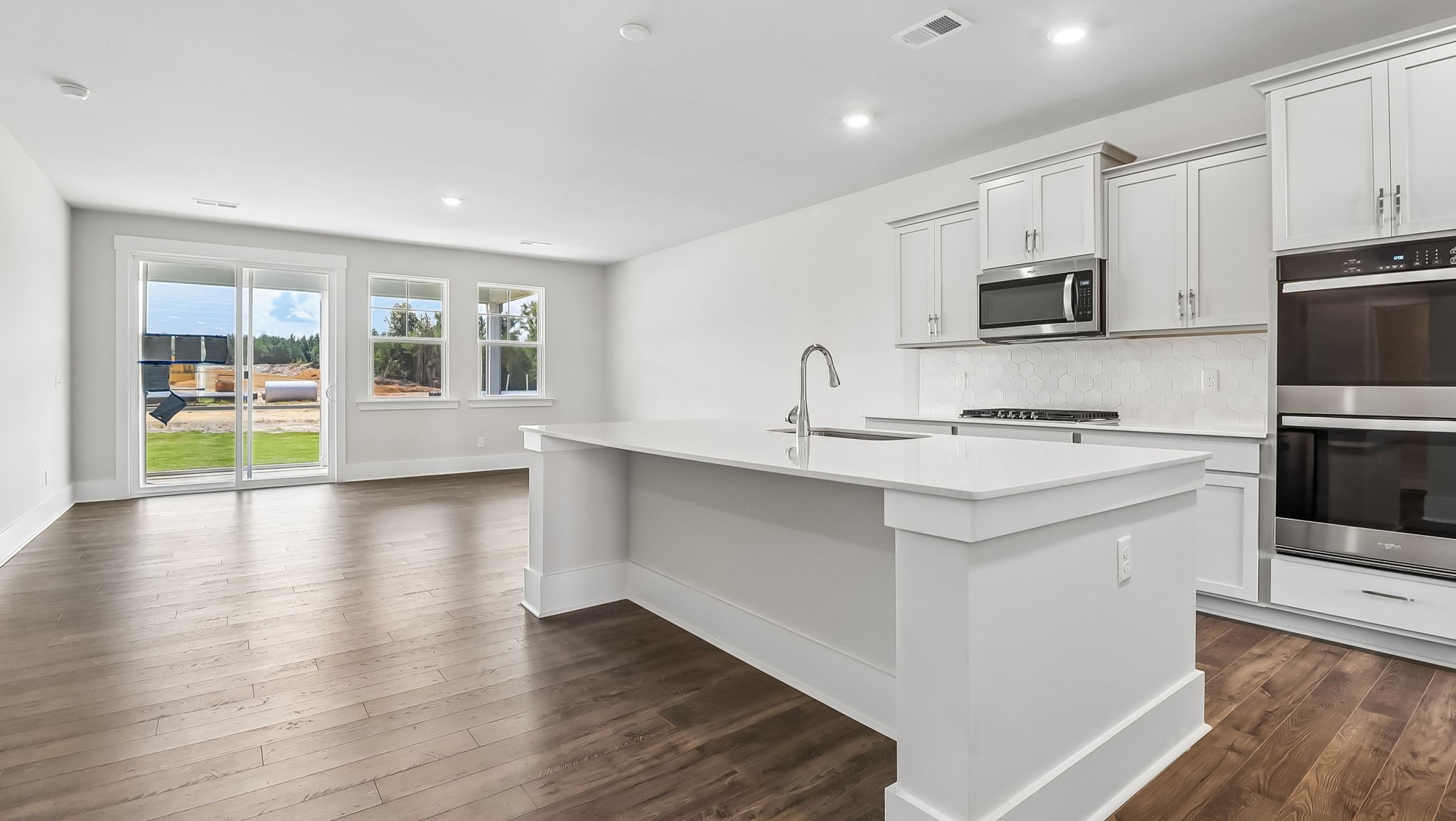 Floating kitchen island with space for barstool seating and an open design