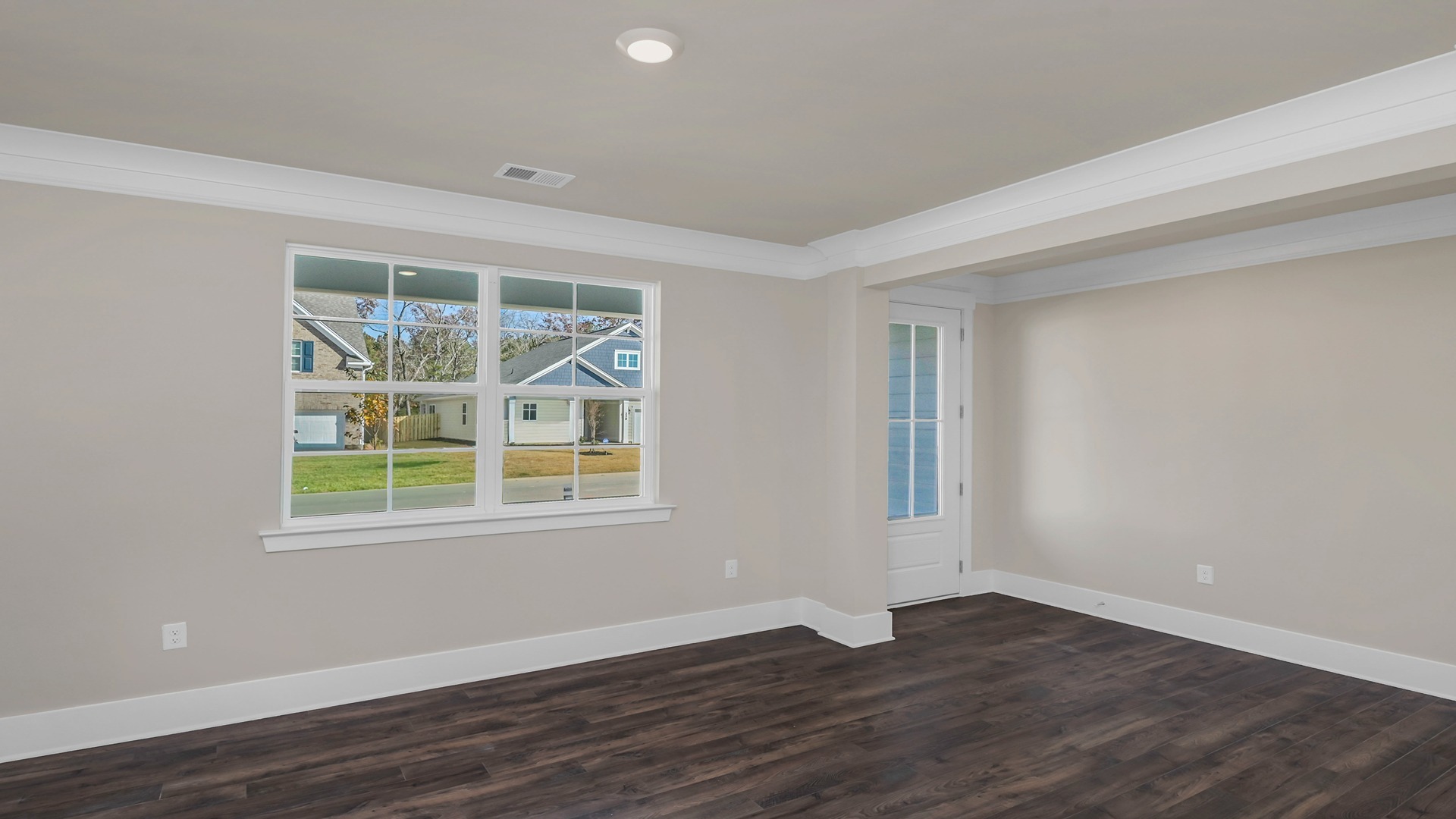 First-floor flex space with natural light and Revwood flooring