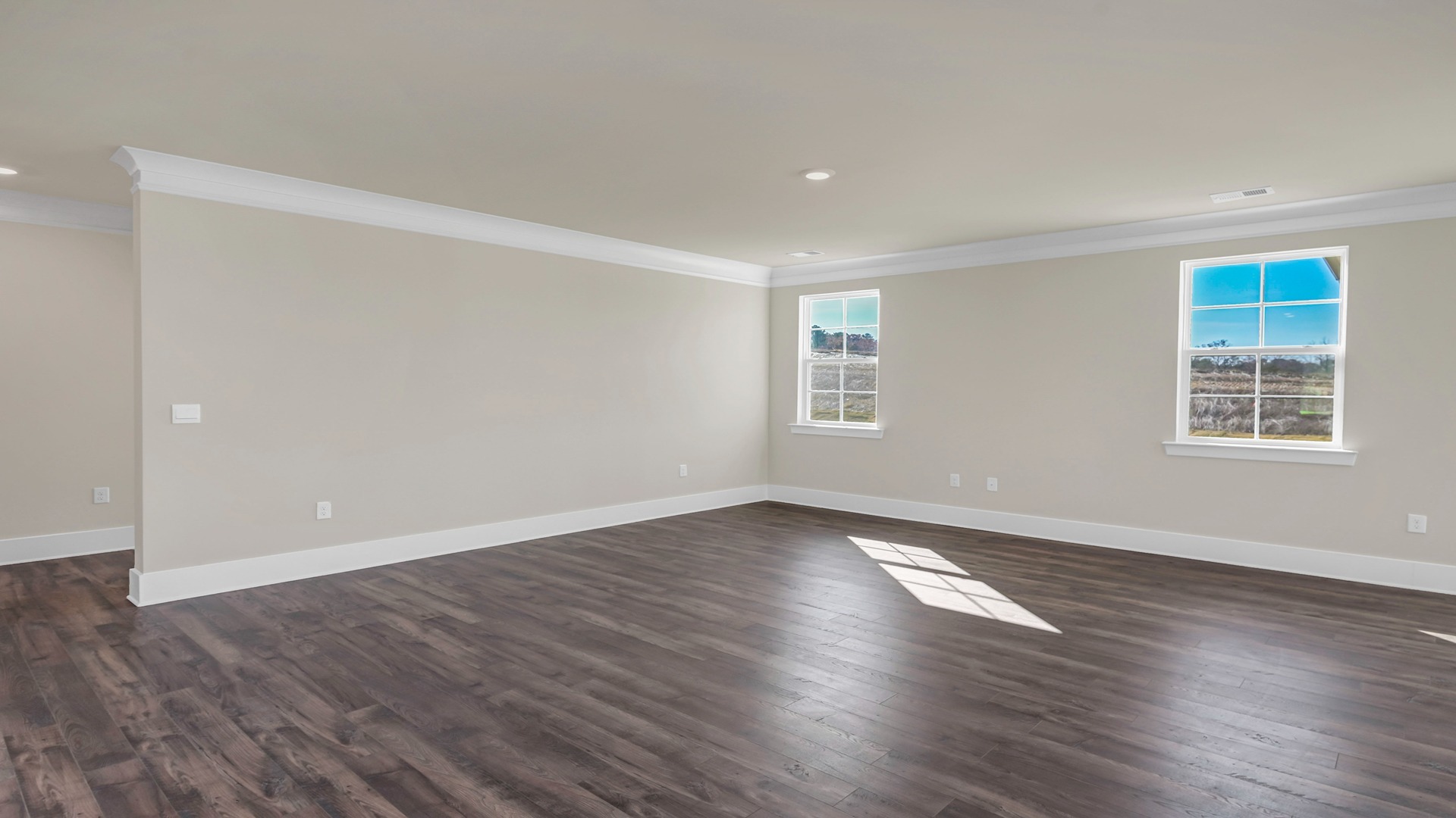 Spacious living area with Revwood floors