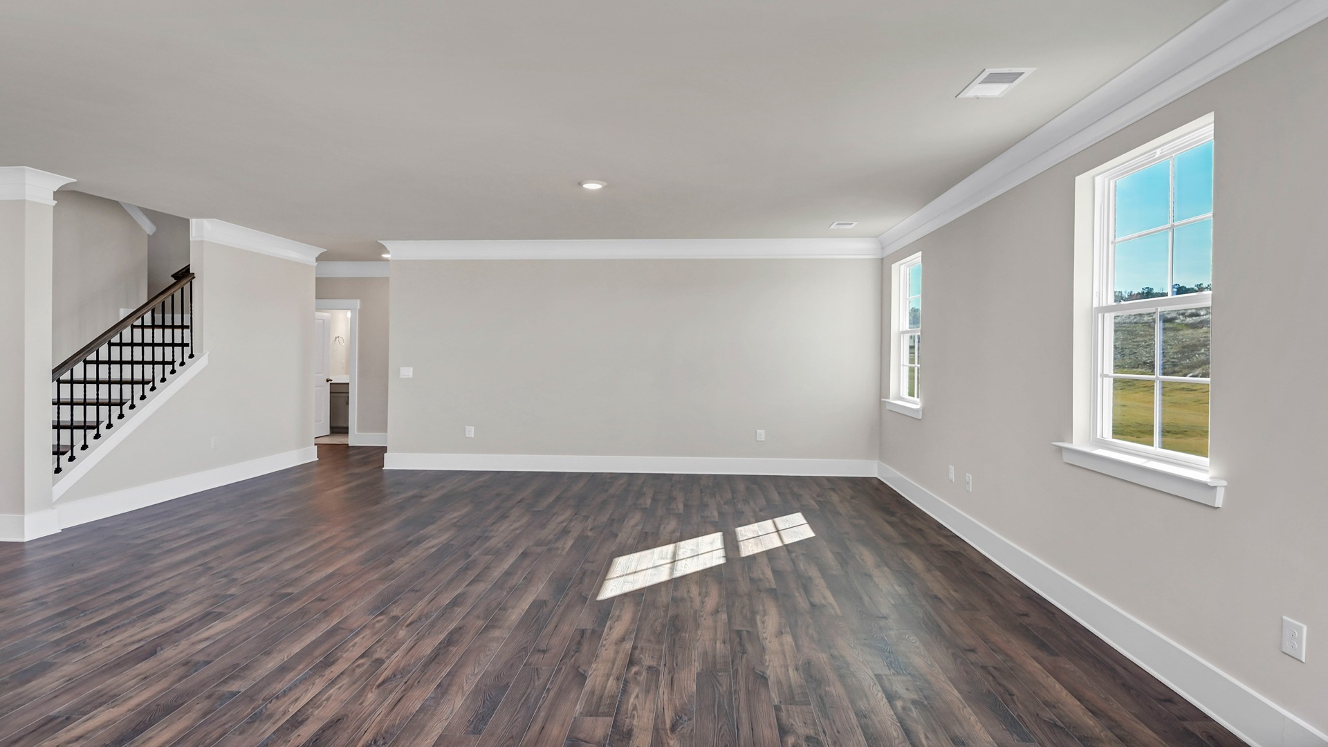 Living area leading to downstairs bedroom