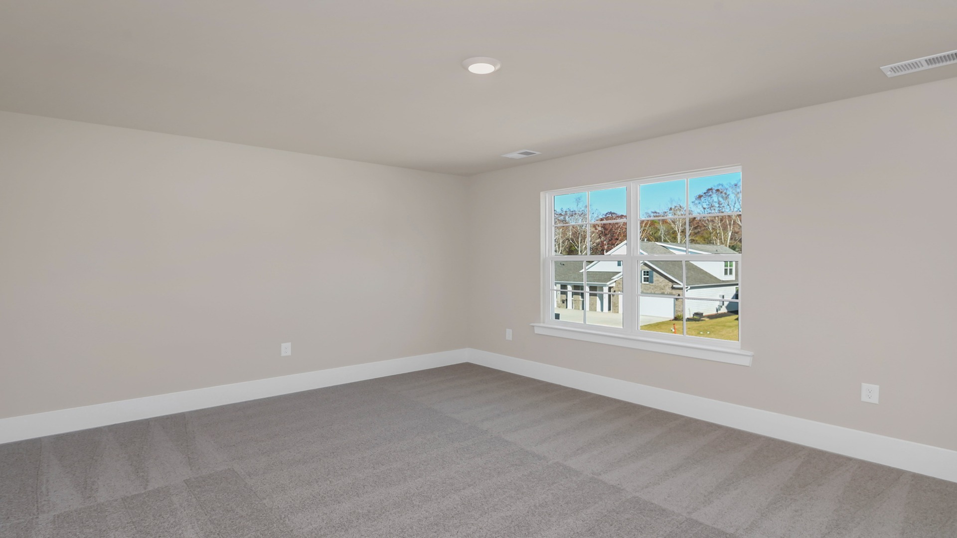 Bedroom 2 upstairs with carpet flooring and natural light