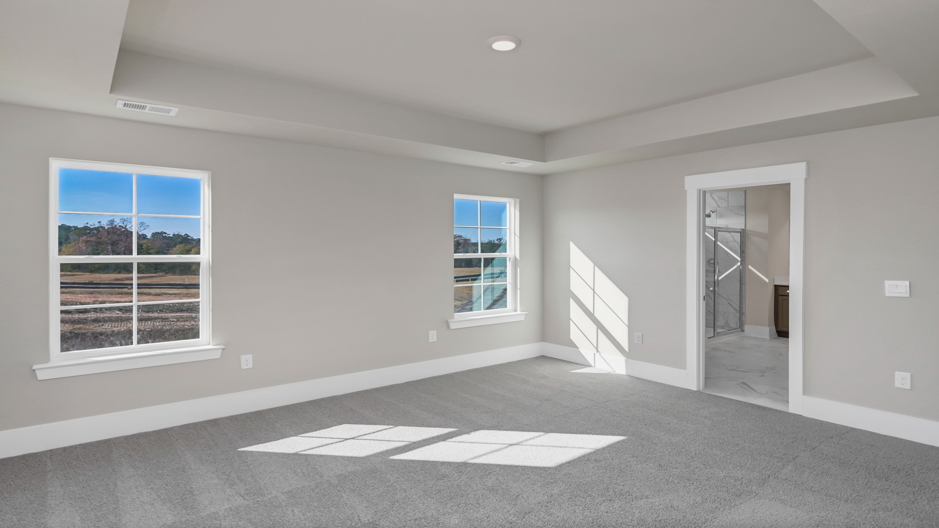 Carpet flooring in primary bedroom