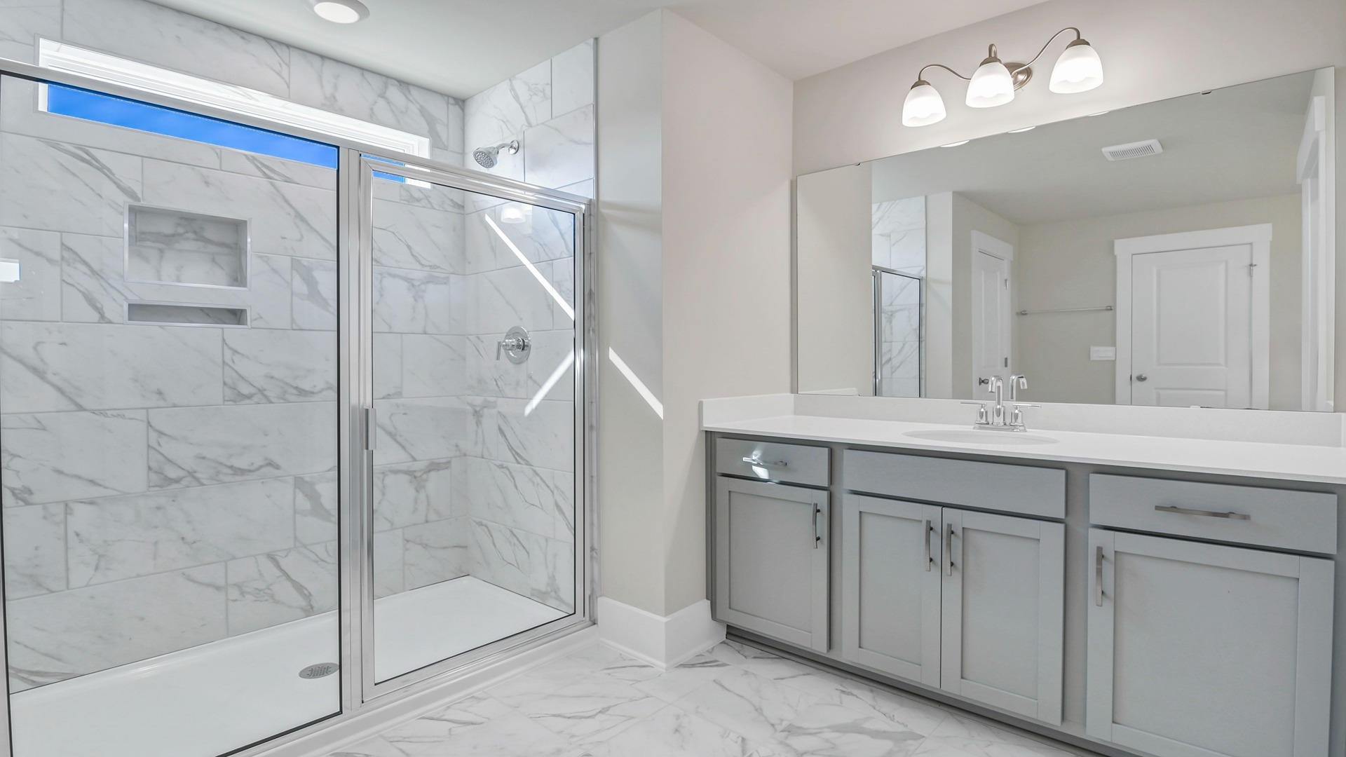 Standup primary shower in primary bathroom