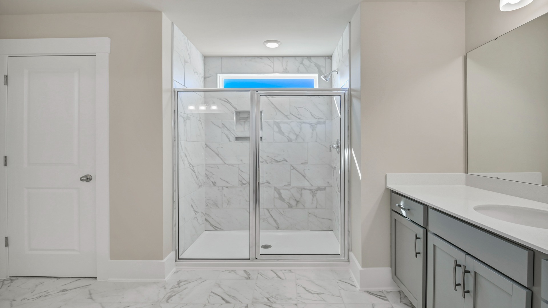 Standup primary shower in primary bathroom