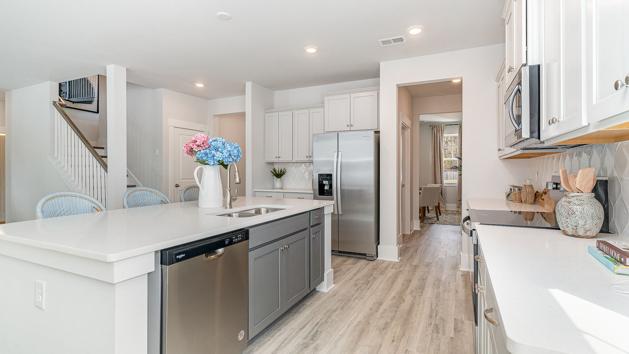 The floating kitchen island overlooks the living area