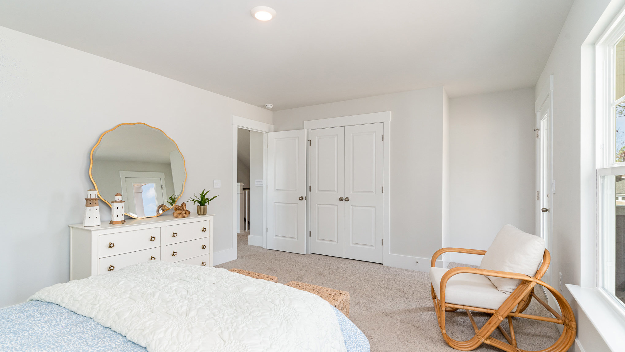 Bedroom 3 is spacious with carpet flooring and several windows