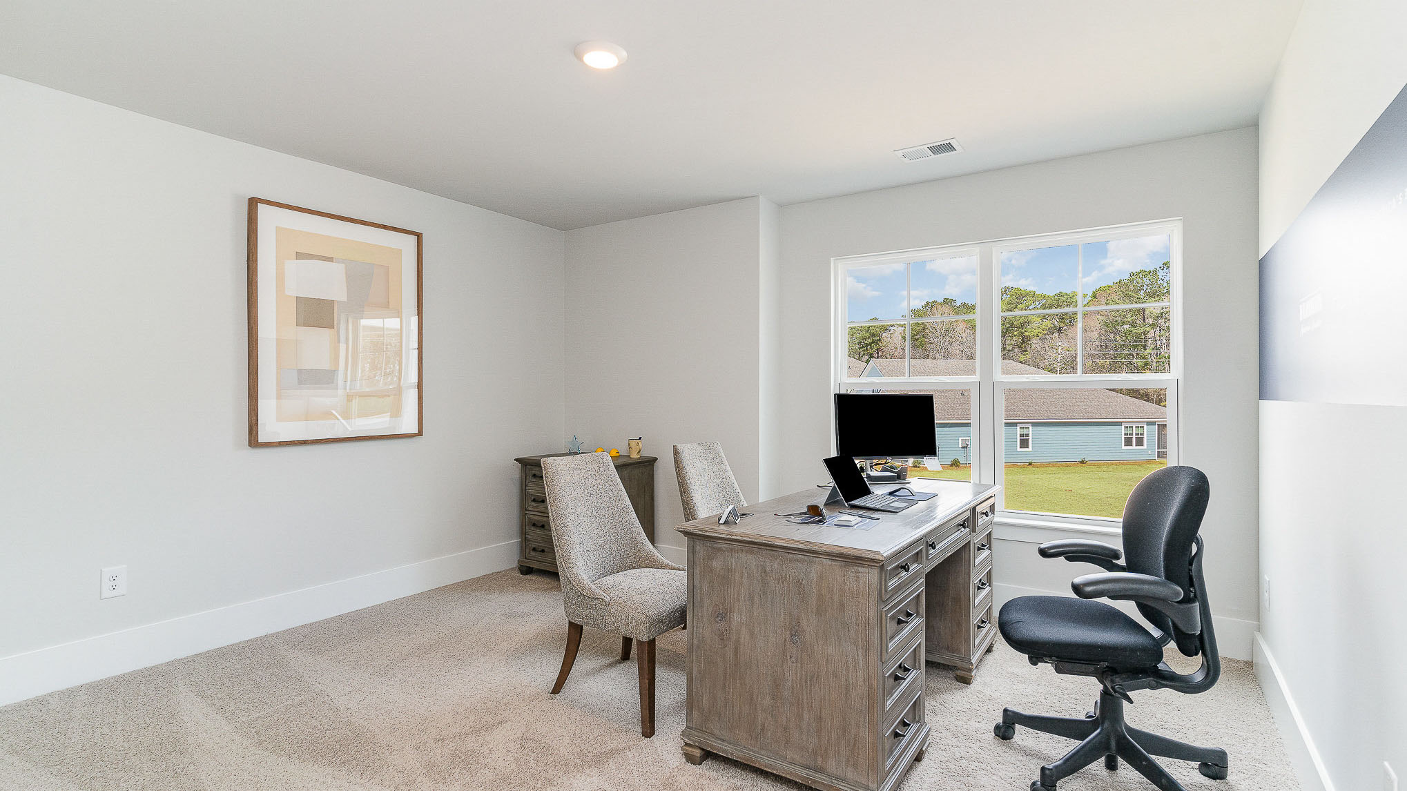 Bedroom 4 is downstairs and is staged as a home office