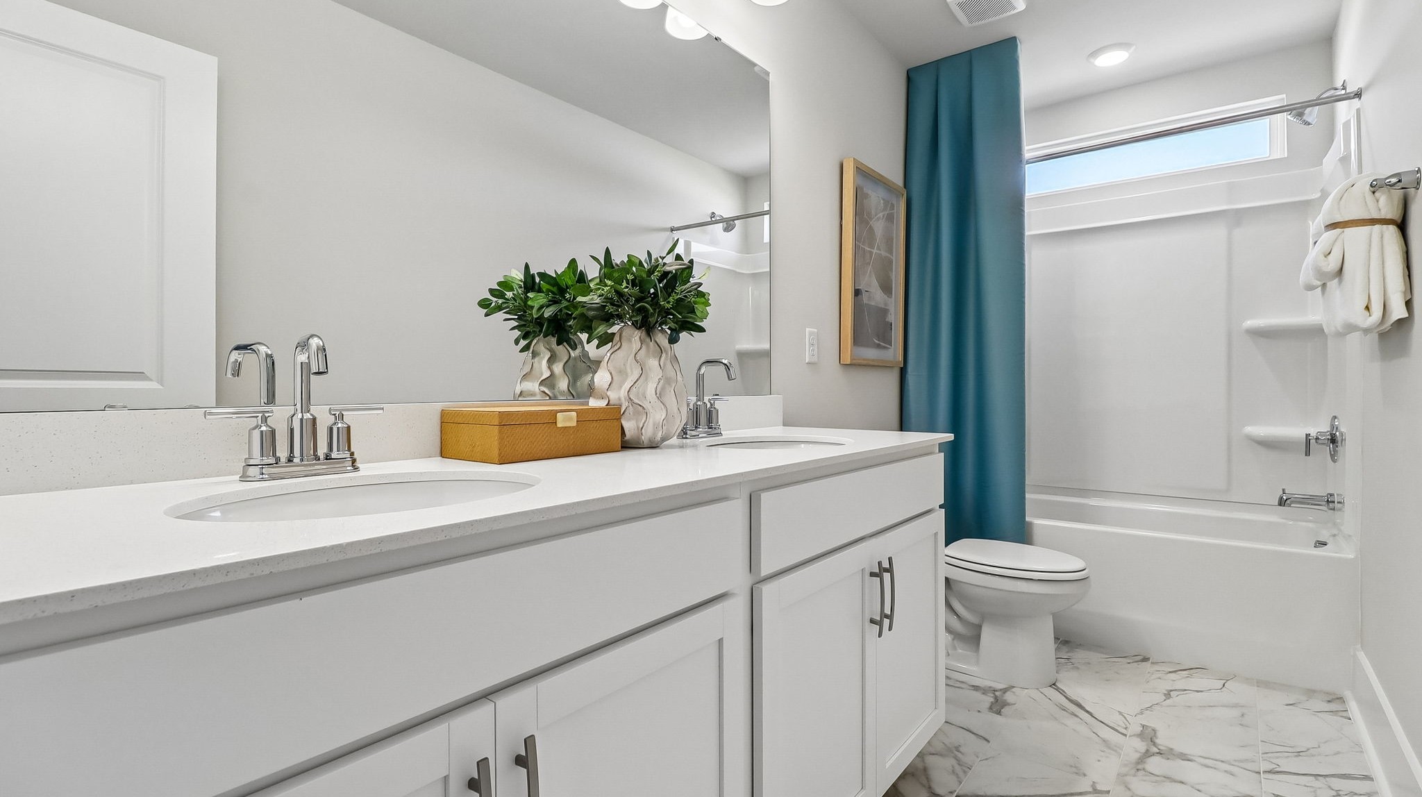 Bathroom 3 upstairs with double vanity and a shower tub located between bedrooms 3 and 4
