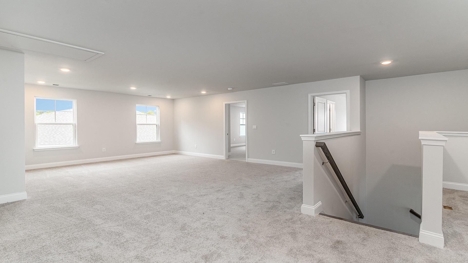 Upstairs loft at the top of oak tread staircase