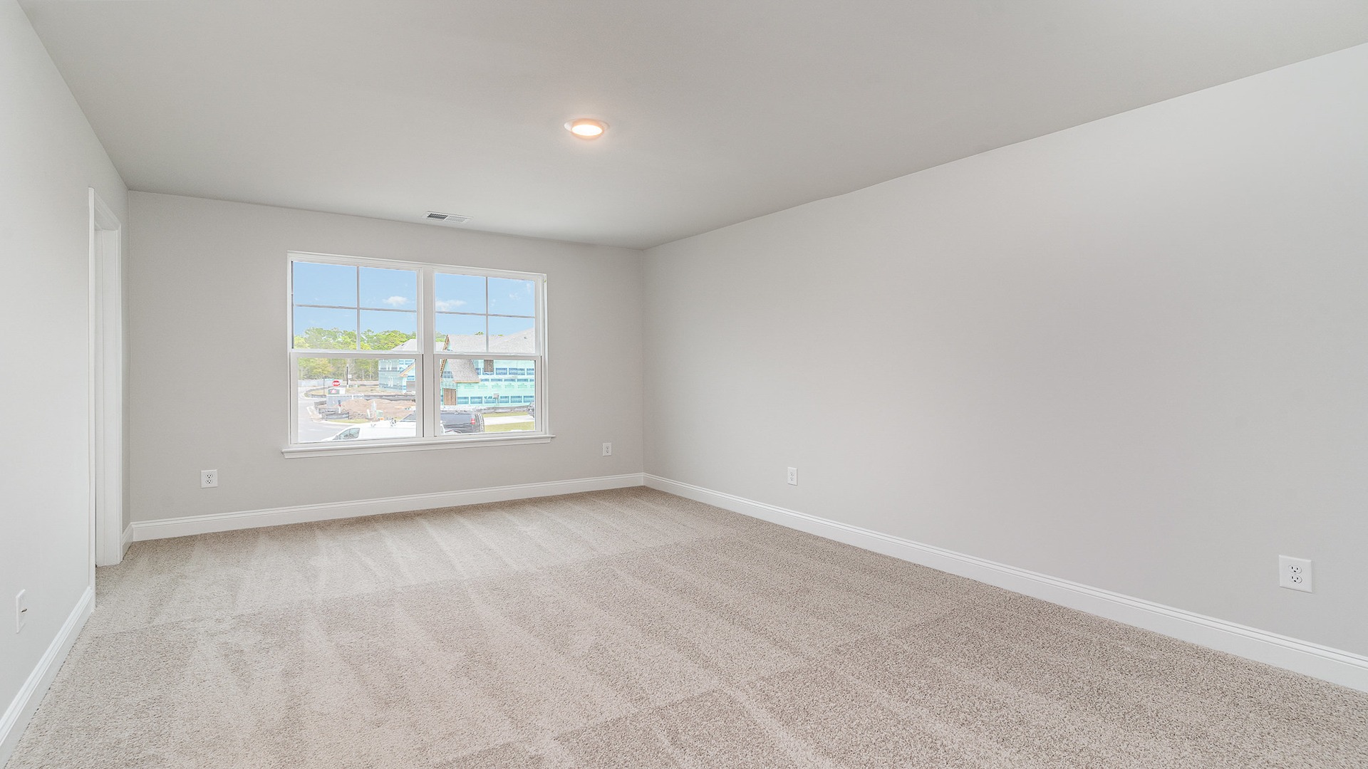 Bedroom 4 upstairs with front facing window and carpet floors