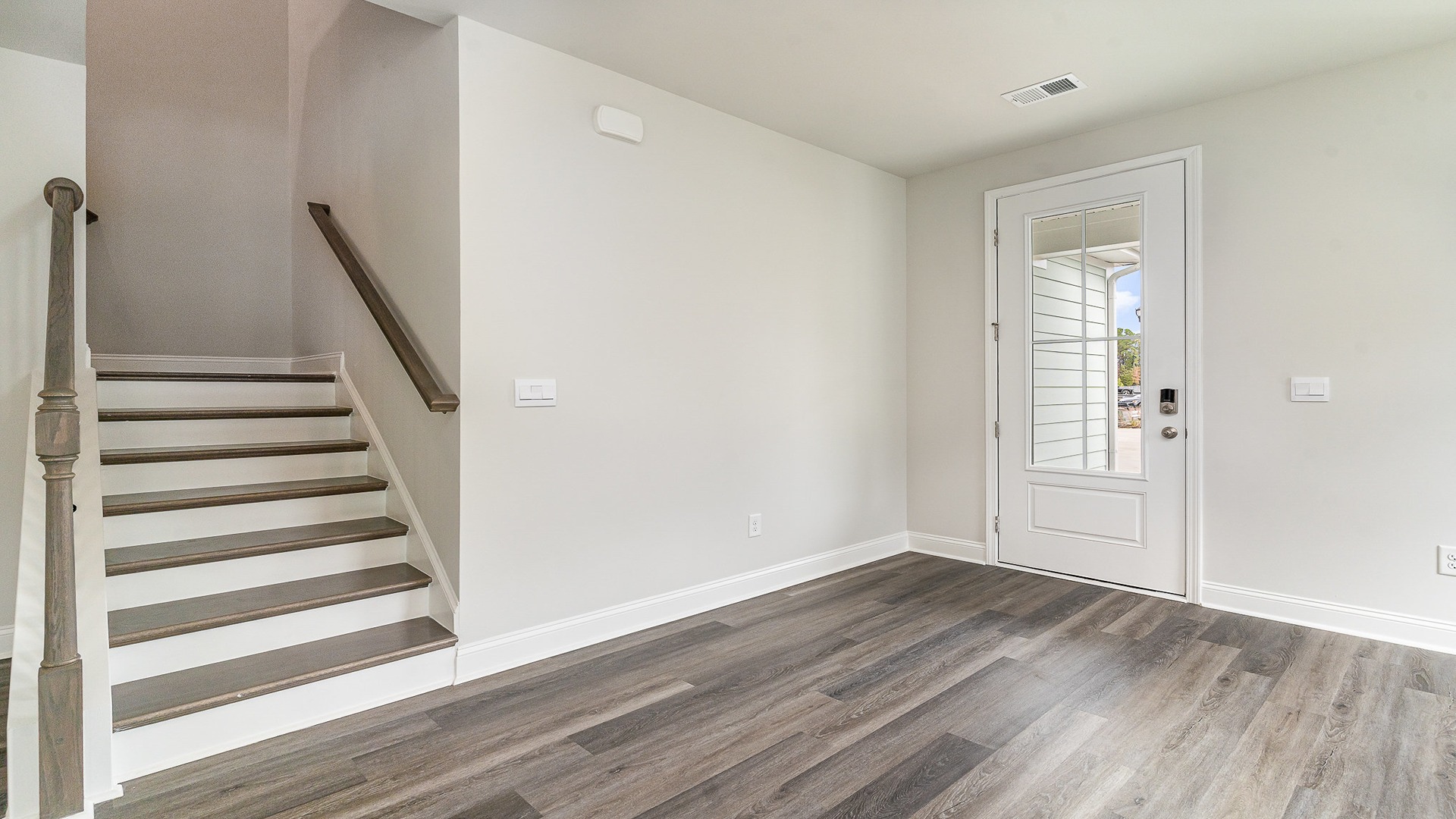 Access to upstairs by the front entrance in the front living room