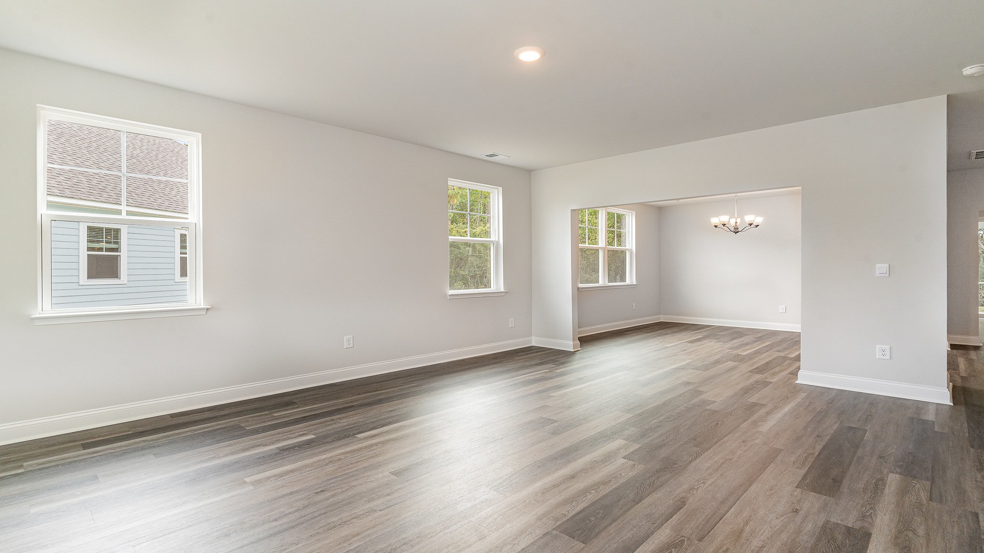 The front living space features Revwood flooring and windows