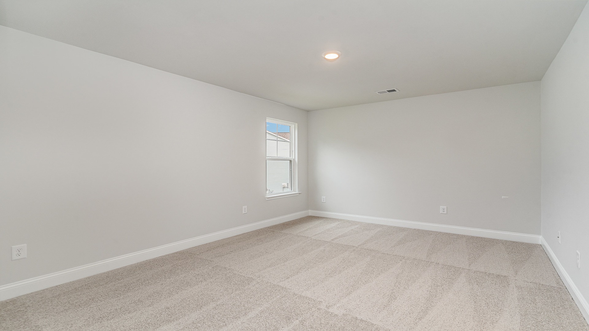 Bedroom 3 upstairs with carpet flooring and French closet doors