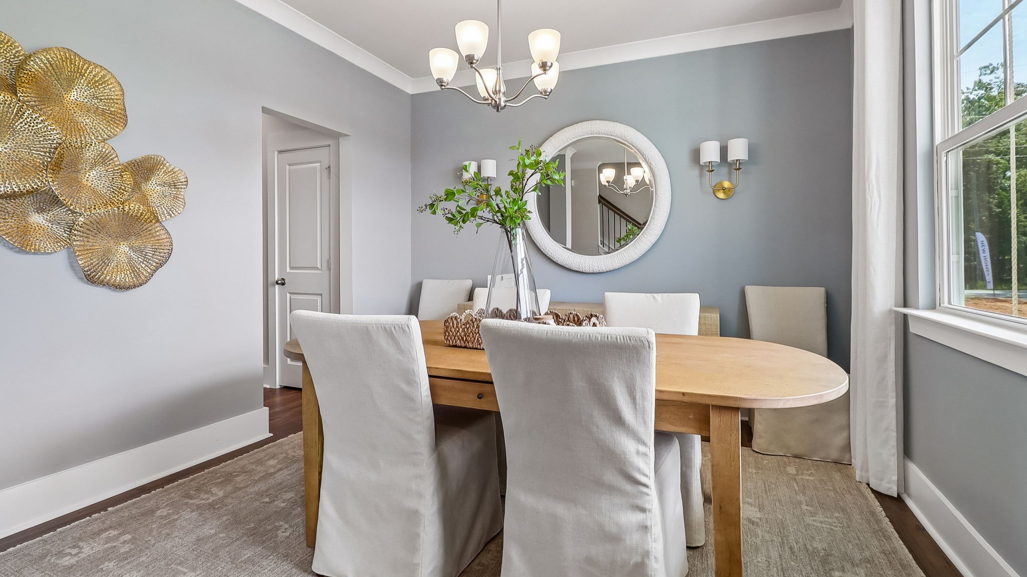 Formal dining area at the front of the home with direct access to the kitchen and front foyer