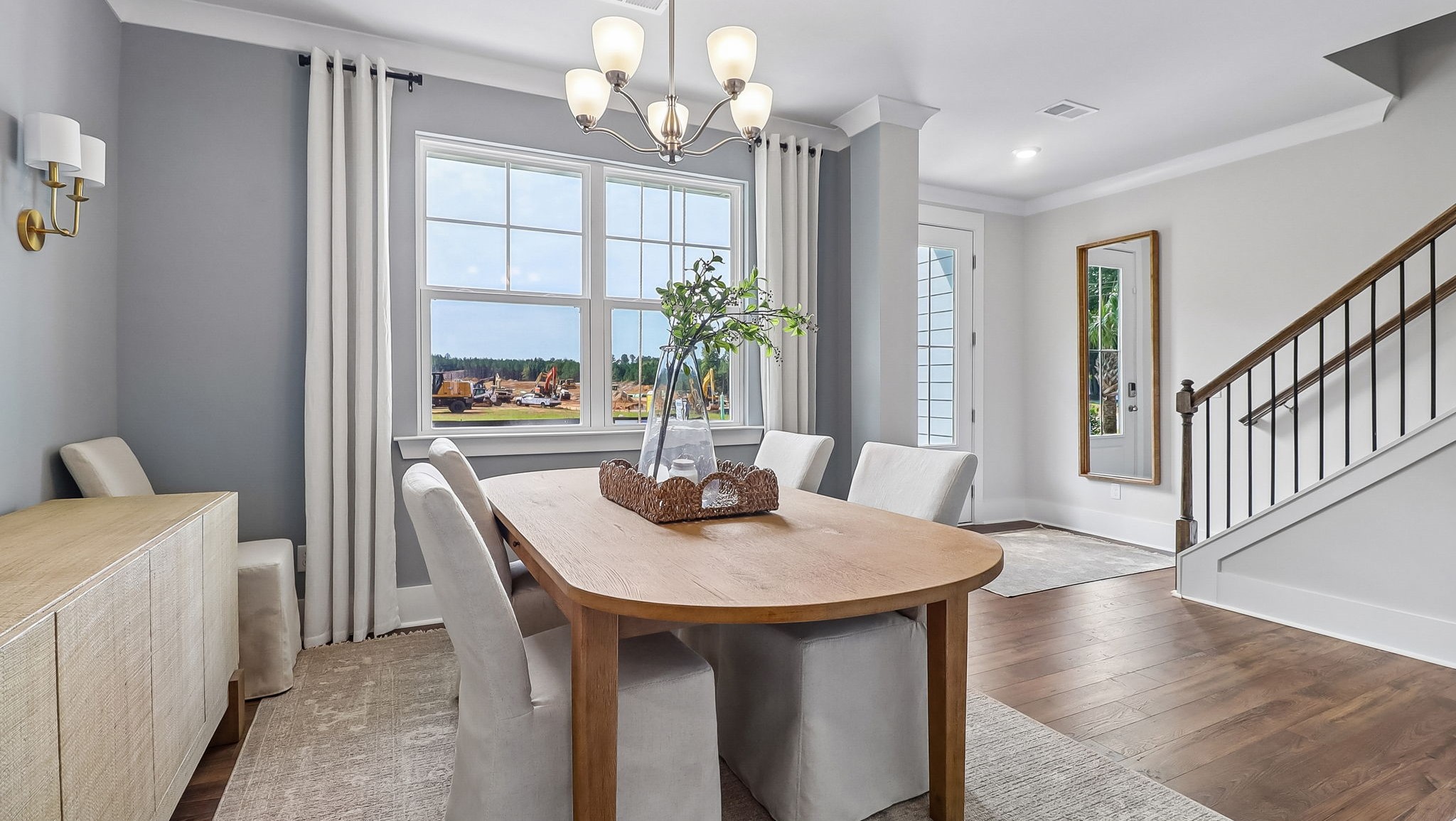 Dining area at the front of the home near the front foyer and stairway to upstairs