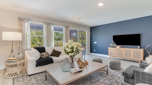 The living area features several large windows