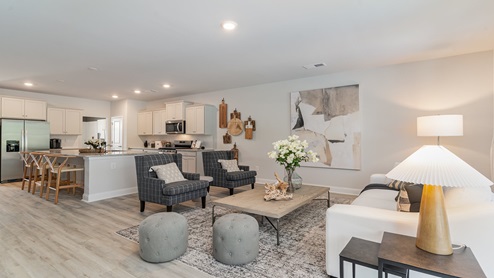 The kitchen and living areas are open concept finished with Revwood flooring