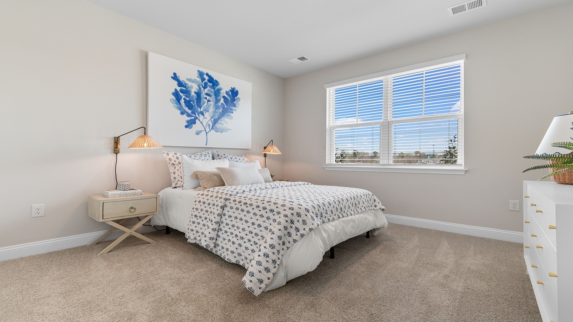 Bedroom with large window and carpet flooring in Old Chapin Reserve