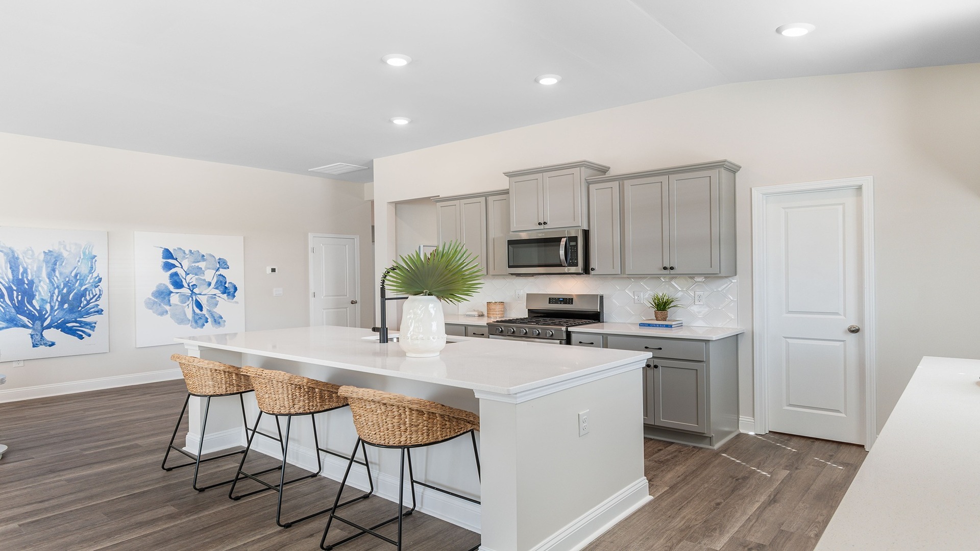 White quartz countertops and tile backsplash in the kitchen Lexington, SC