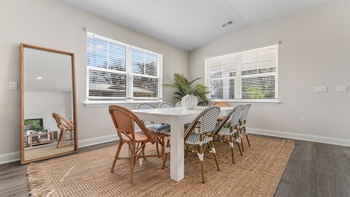 The dining area is spacious with lots of natural light