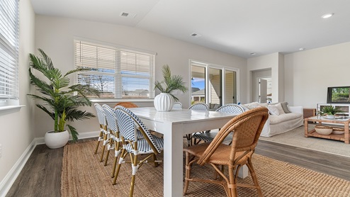 The dining area is spacious with lots of natural light