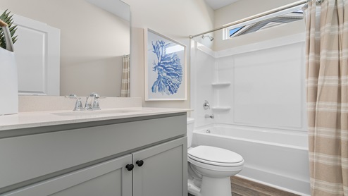 Additional bathroom towards the front of the home with a shower/tub combo