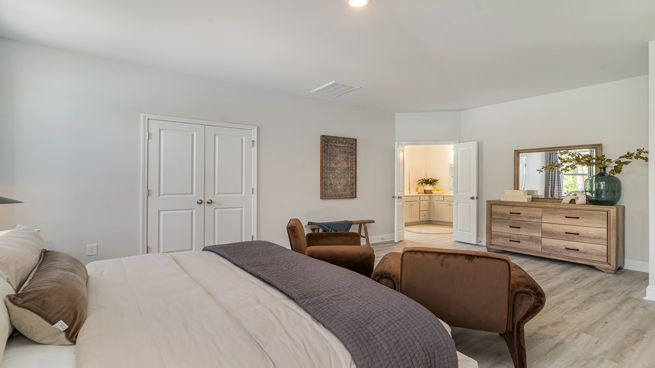 Tillman primary bedroom comfortably fits a king bed