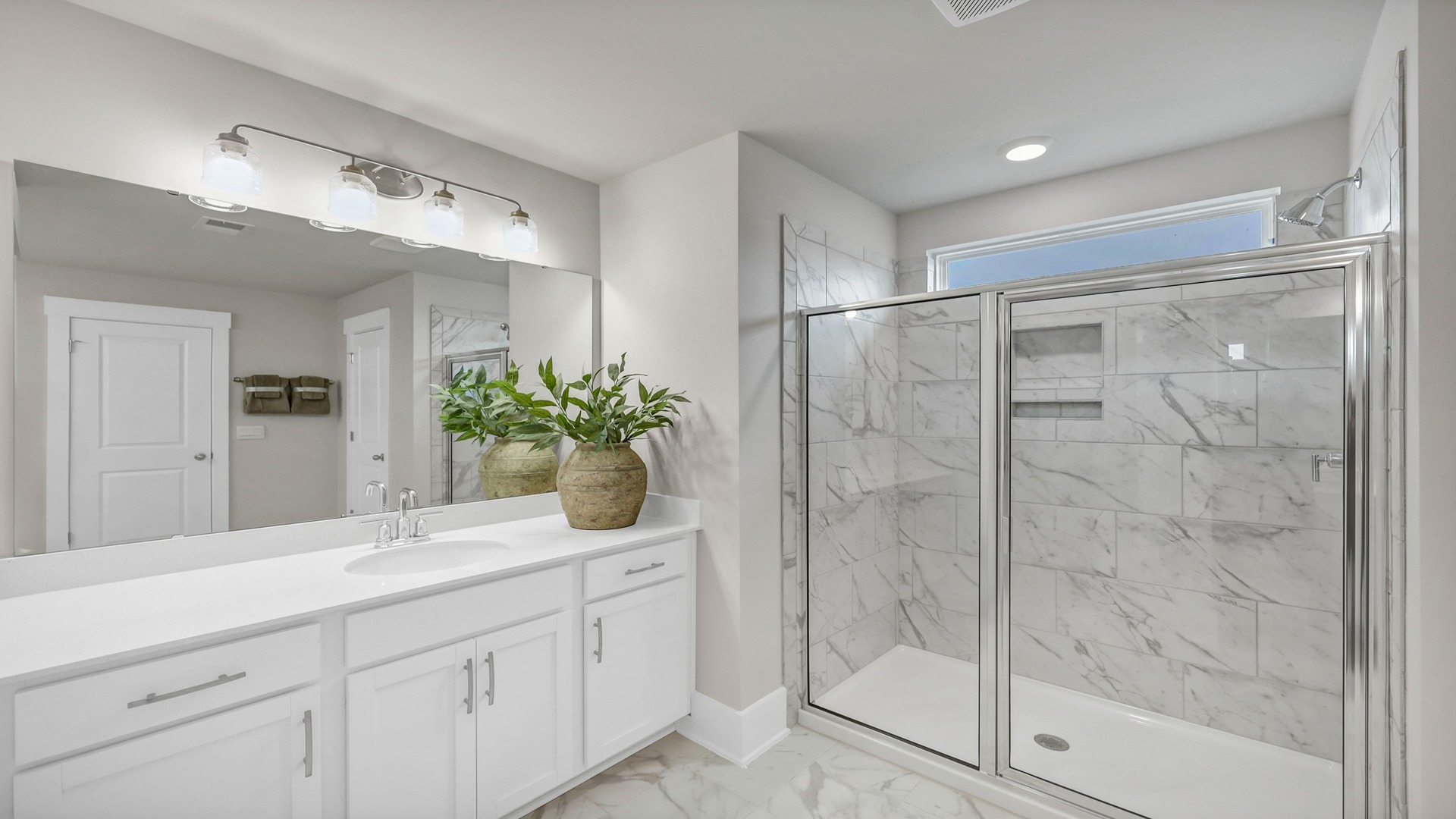 En-suite primary bathroom with standup shower that has the option to be tiled