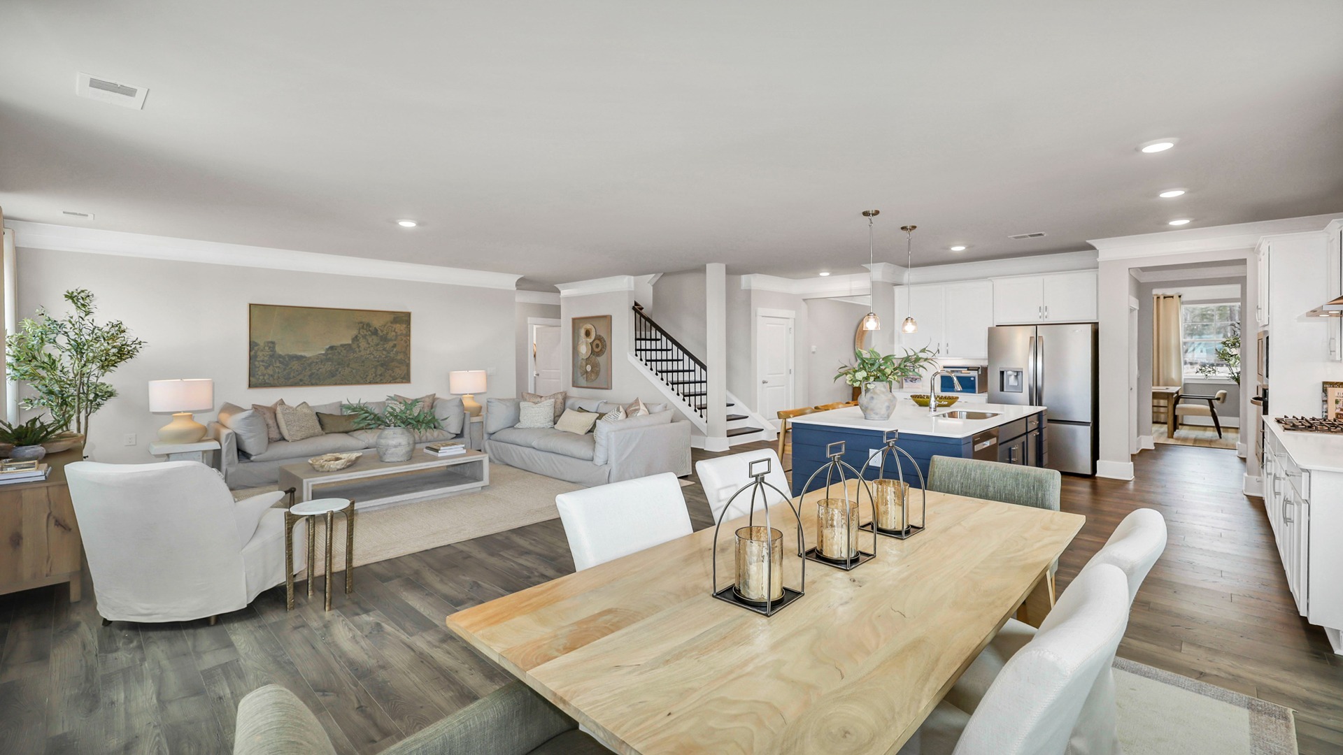 View of kitchen and living areas from dining area
