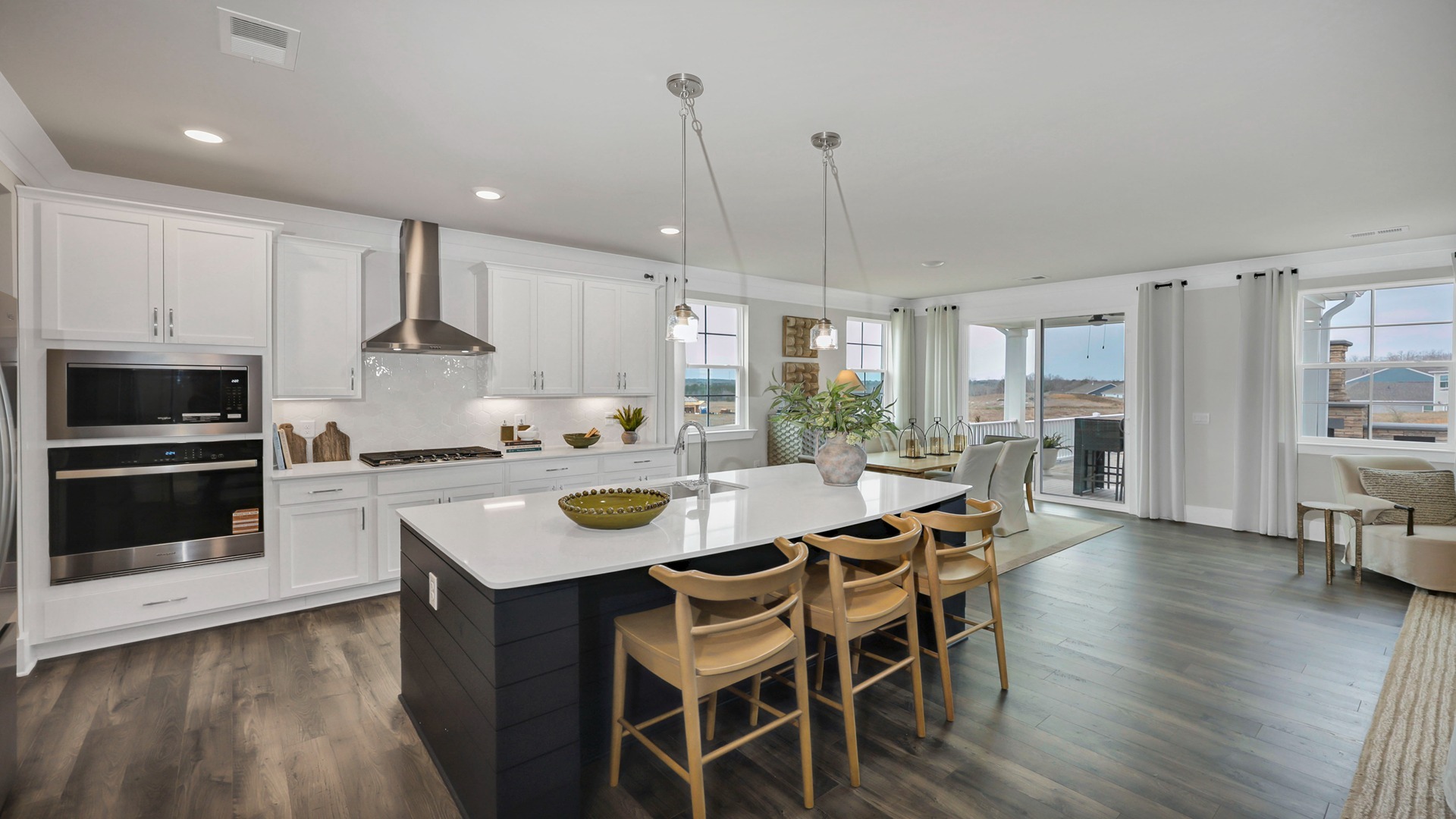 Harbor Oak kitchen with white cabinetry and a color pop island