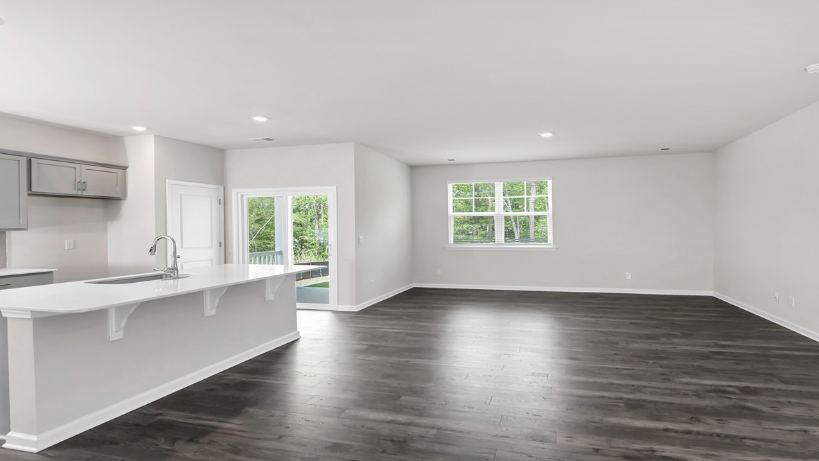 The kitchen and living areas are finished with matching Revwood flooring