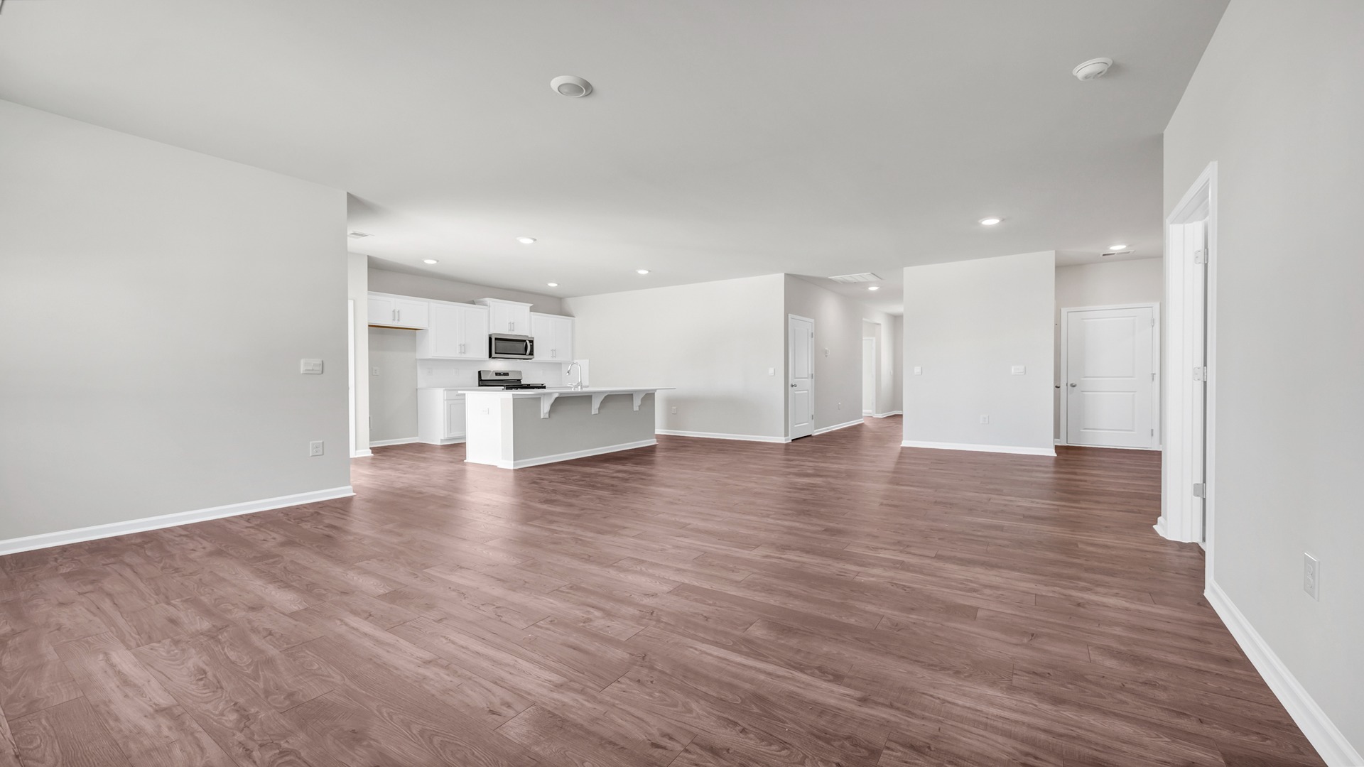 Living area leads into primary bedroom
