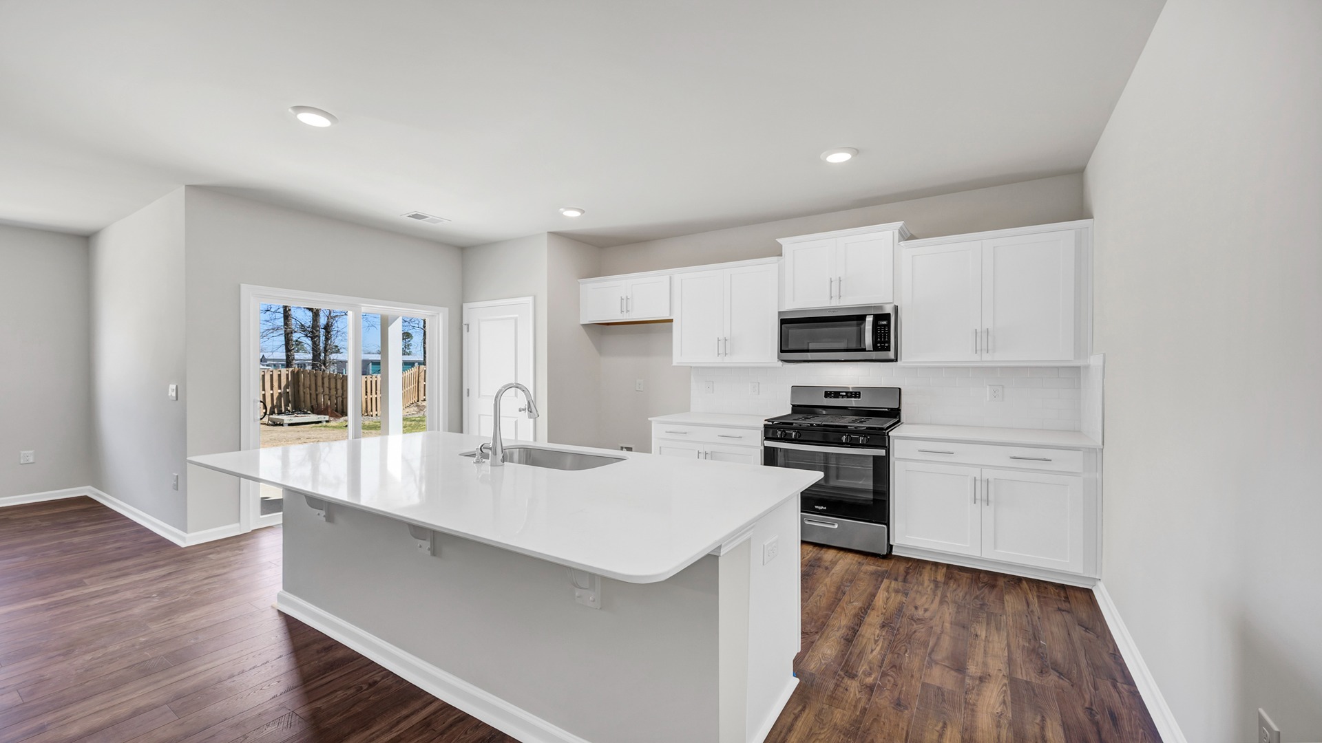 There is also tile backsplash in the kitchen.