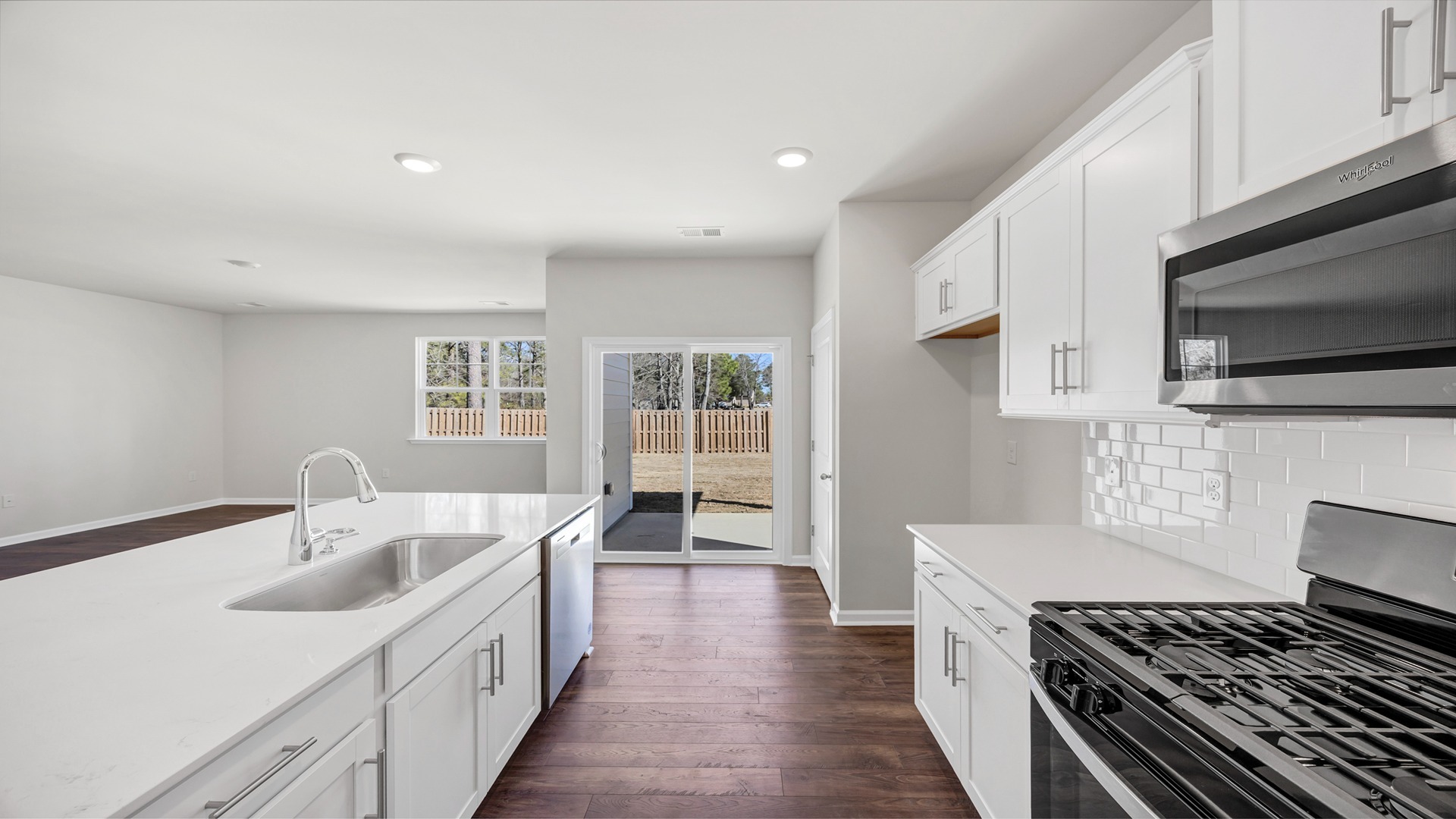 The floating kitchen island overlooks the living area
