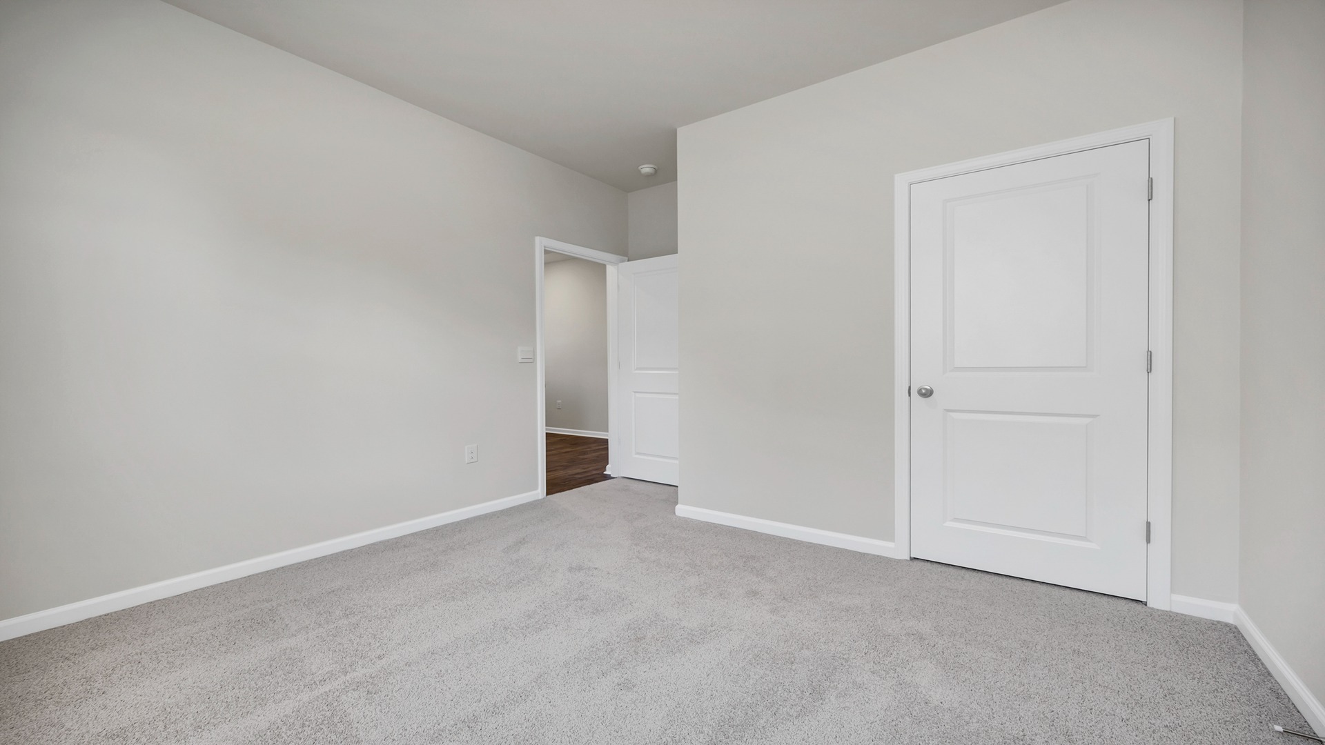 Bedroom 3 with a window and carpet