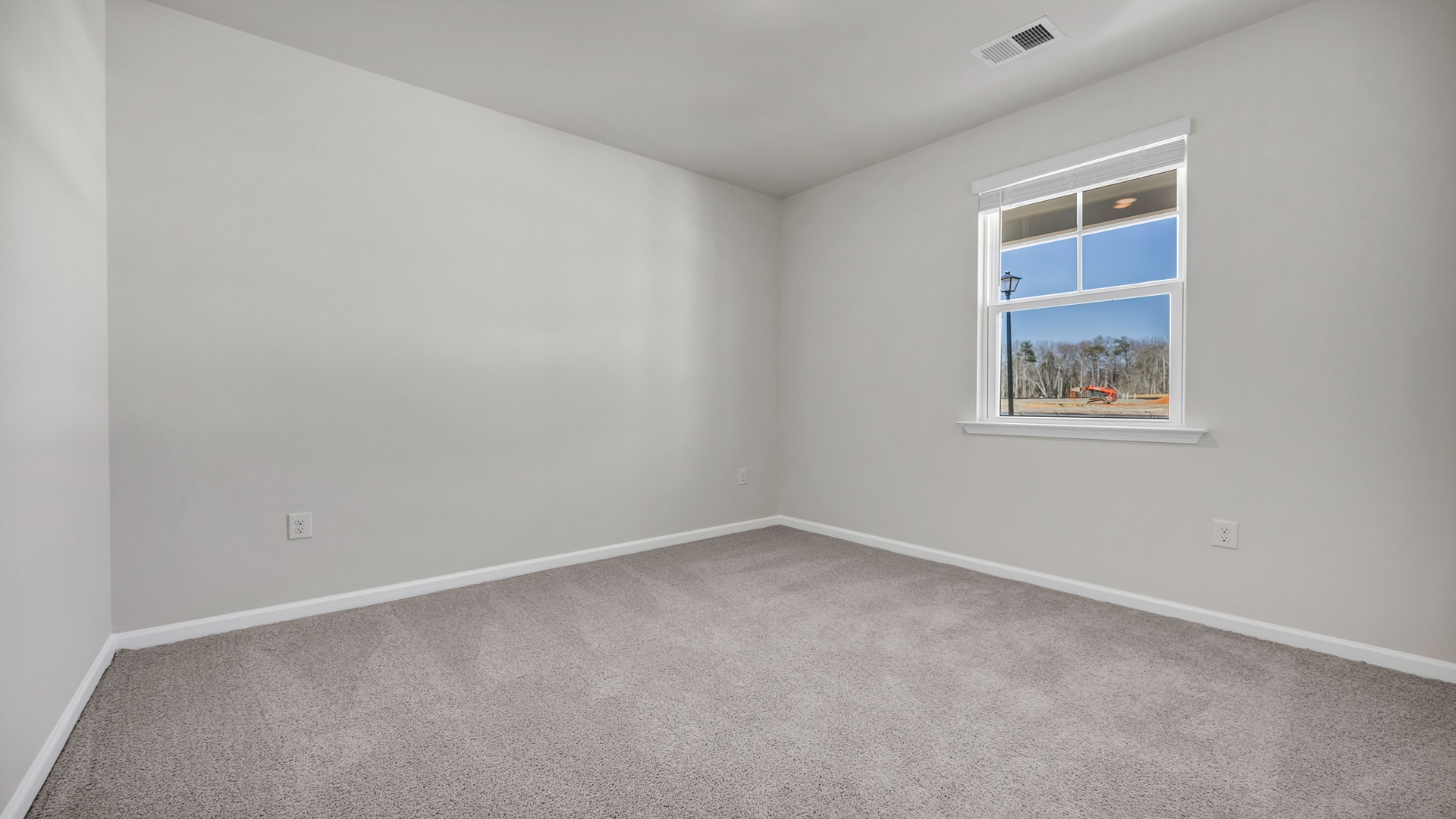 Bedroom 4 with front facing window and carpet flooring