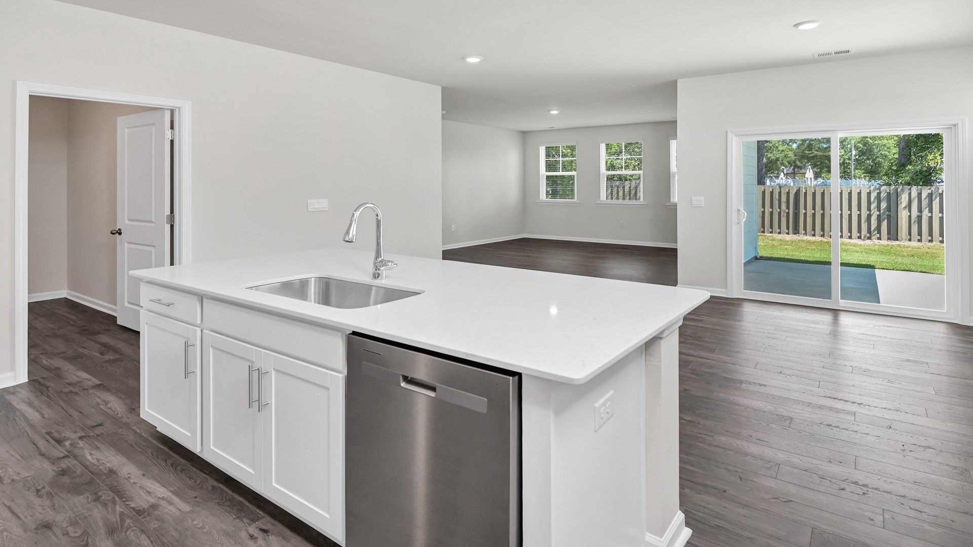 Sleek, white quartz countertops in the kitchen