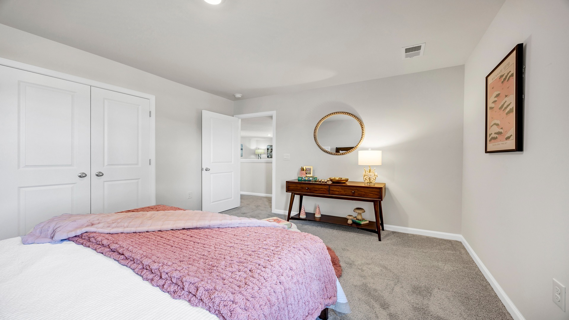Bedroom 3 upstairs with carpet flooring and French closet doors