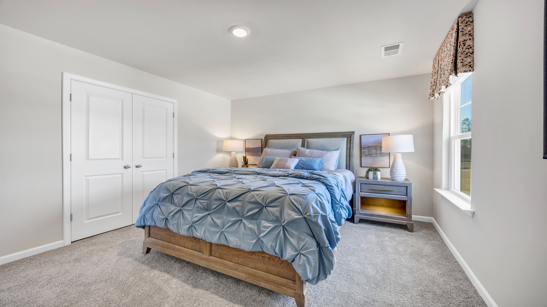 Bedroom 2 upstairs with French closet doors